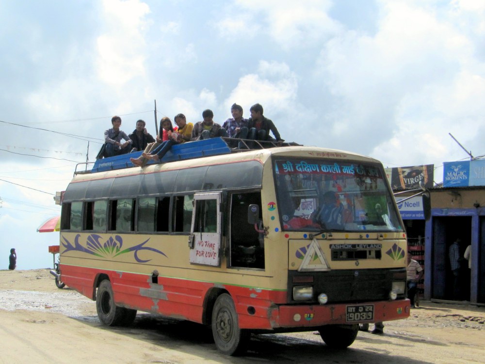 Nepal bus with people on the roof